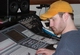 Randy sets the headphone levels as he readies the recording equipment